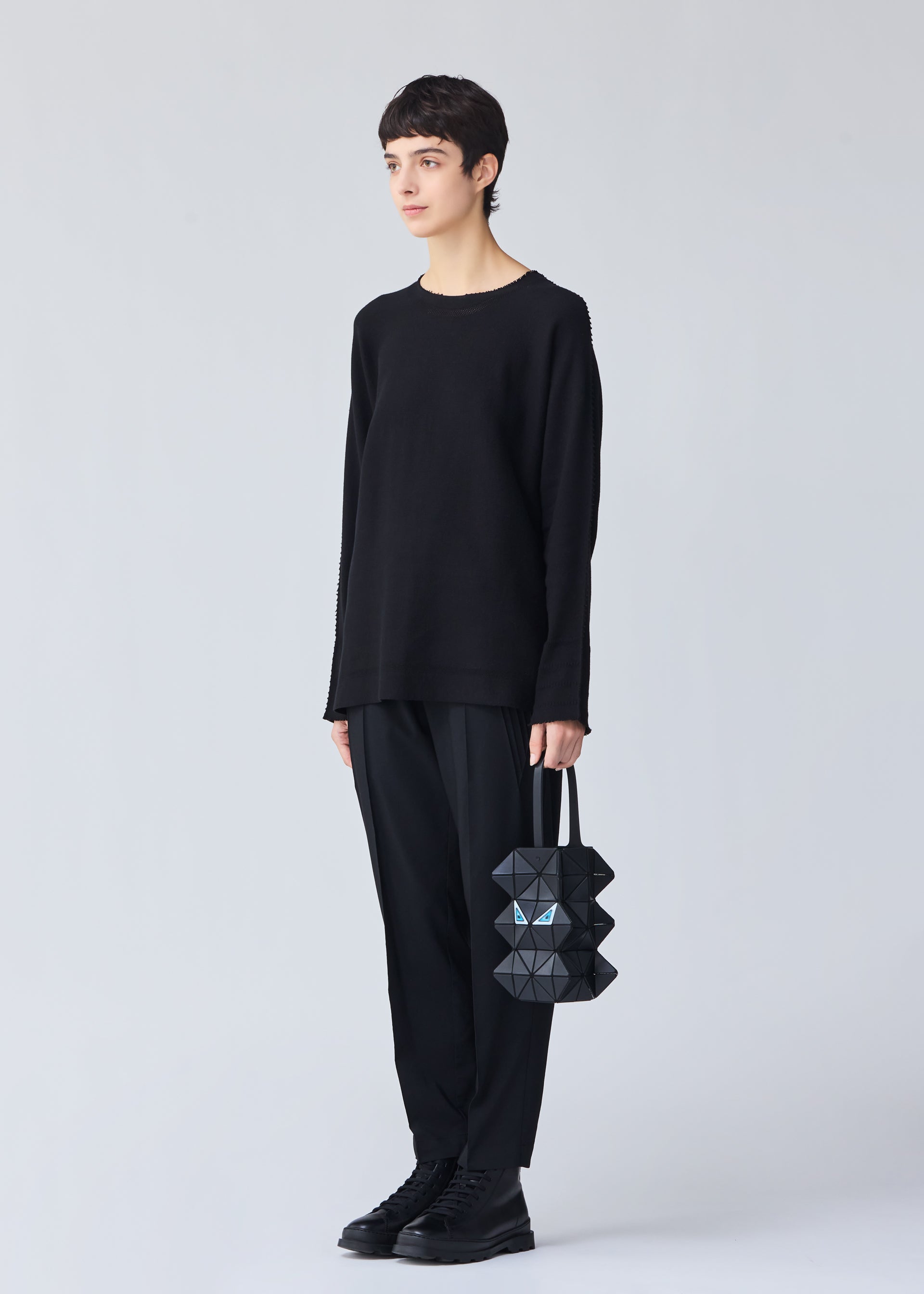 A model wears the BAO BAO ISSEY MIYAKE MEOW 0.