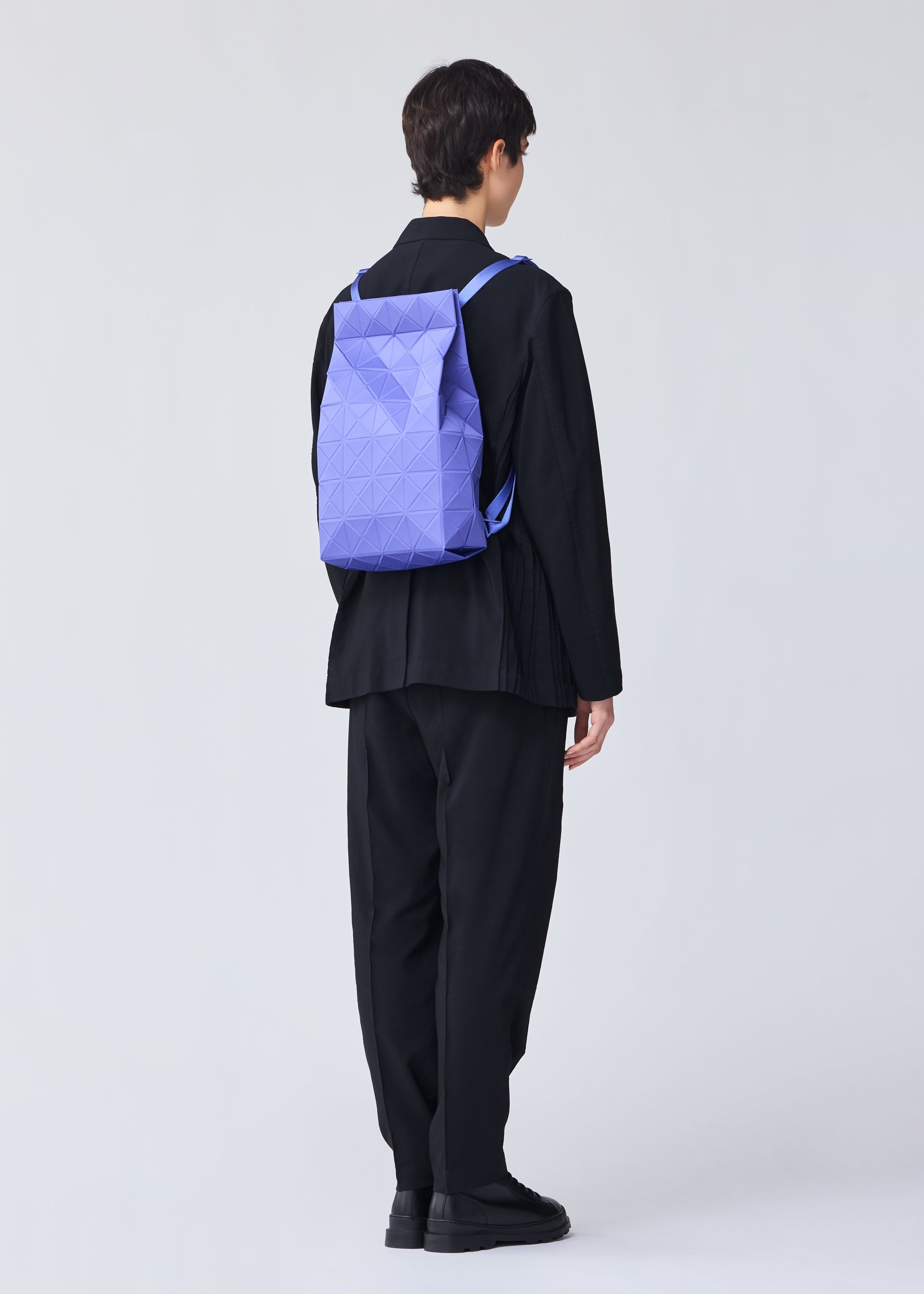 A model wears the BAO BAO ISSEY MIYAKE TRACK backpack.
