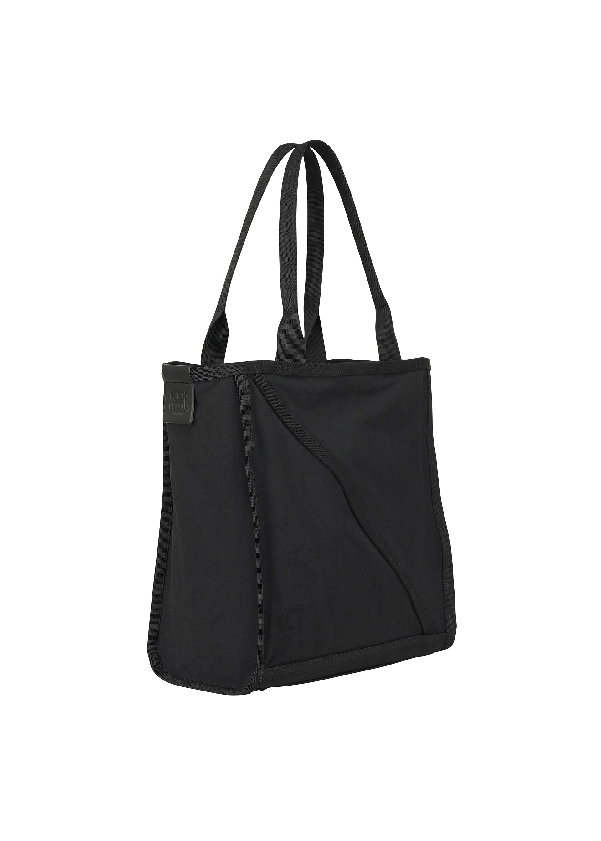 A detail shot of the GOOD GOODS ISSEY MIYAKE WAKU bag.