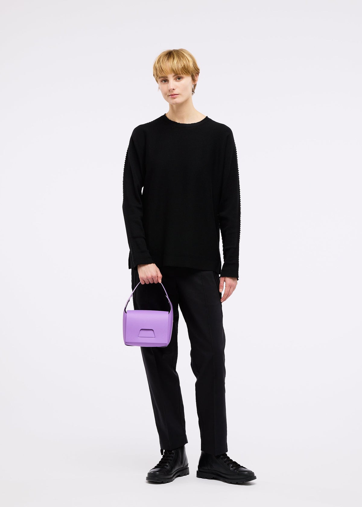 A model wears the GOOD GOODS ISSEY MIYAKE BOX bag.