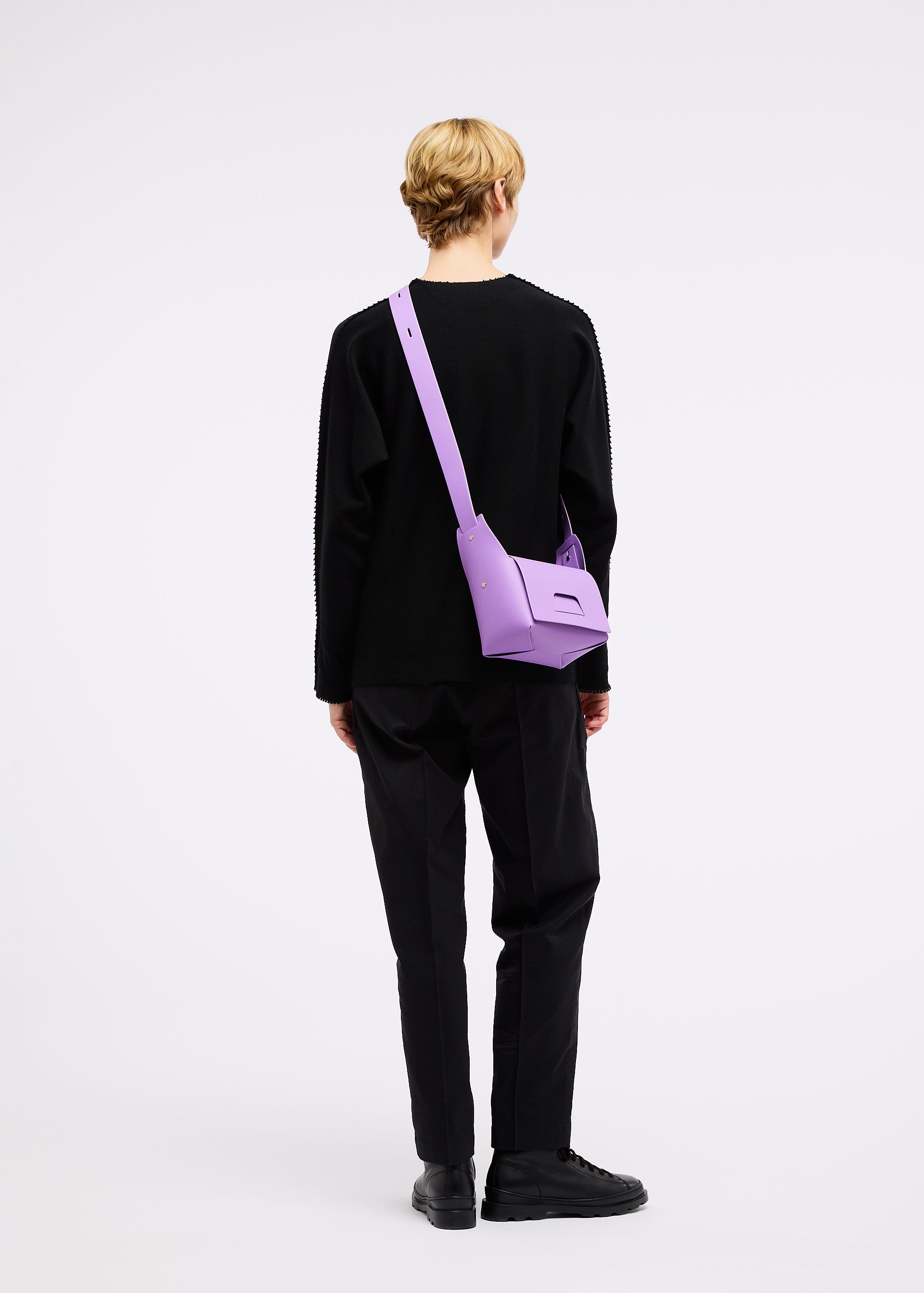A model wears the GOOD GOODS ISSEY MIYAKE BOX bag.