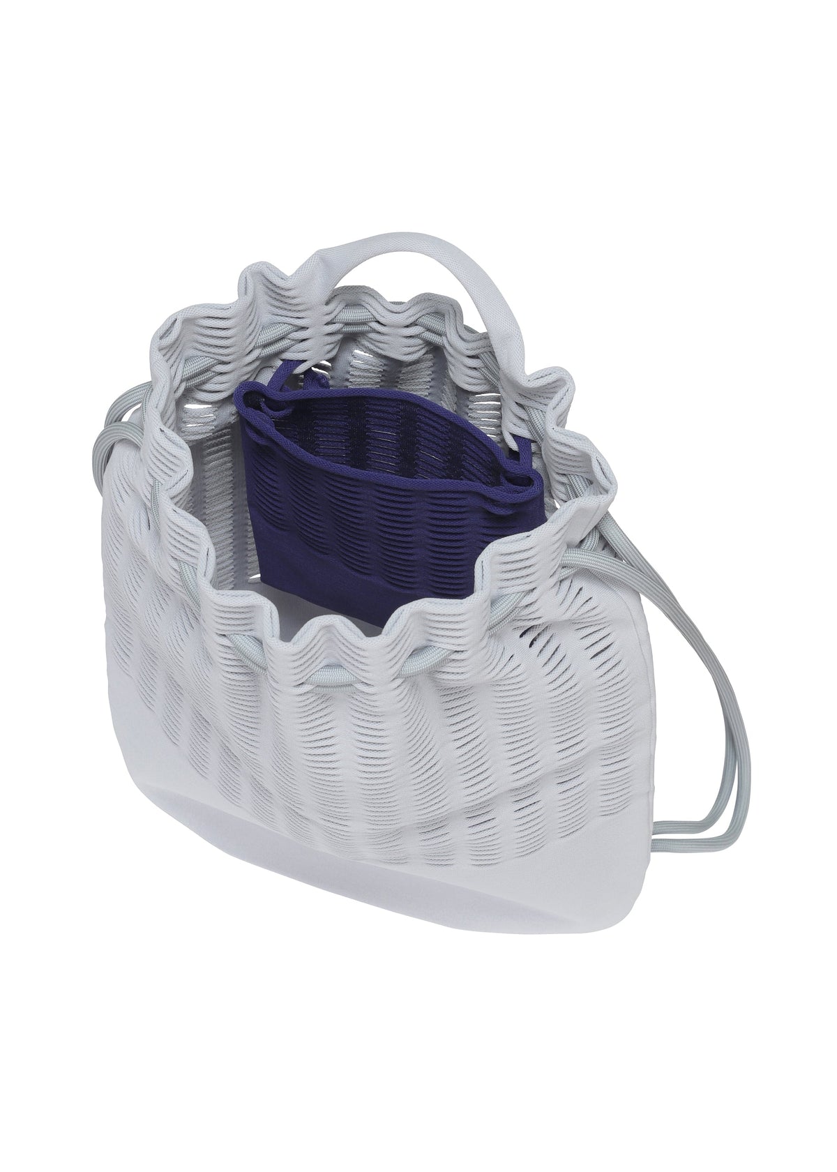 A detail shot of the GOOD GOODS ISSEY MIYAKE MOKKO KNAPSACK bag.