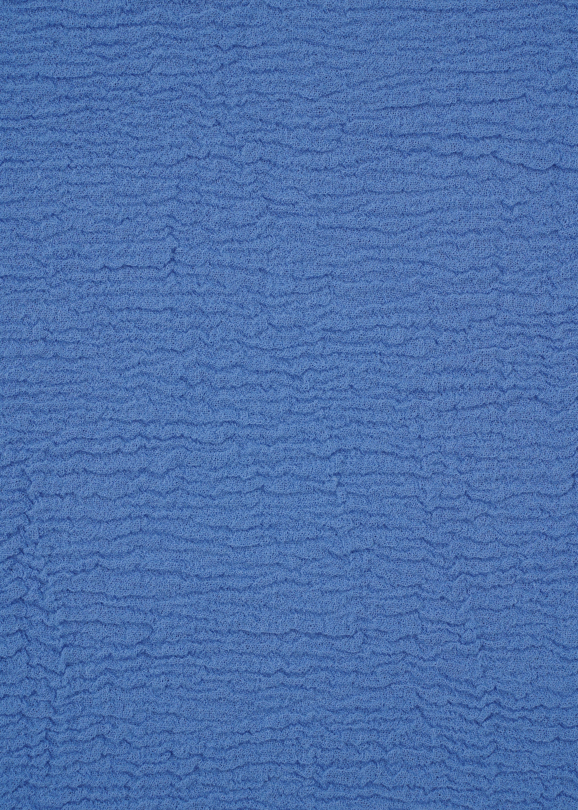 A detail shot of the HAAT KYO CHIJIMI 2WAY top