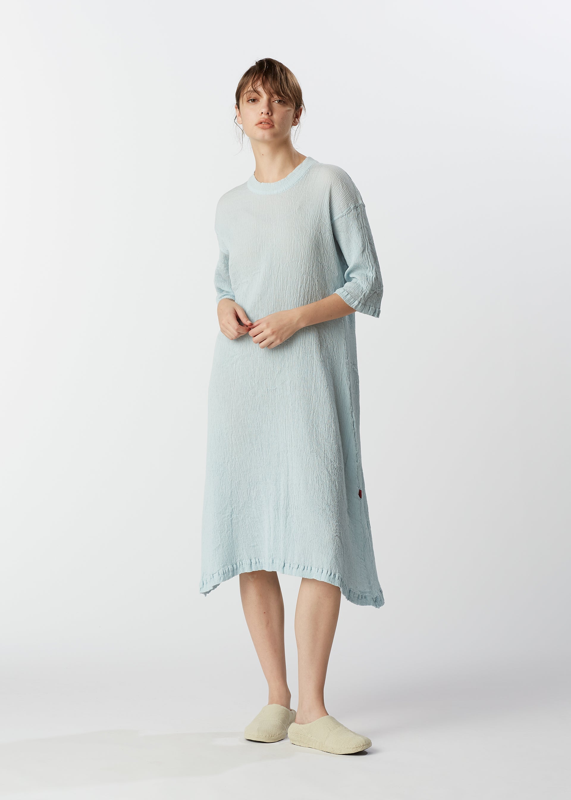 A model wears the HAAT KYO CHIJIMI MAY dress.