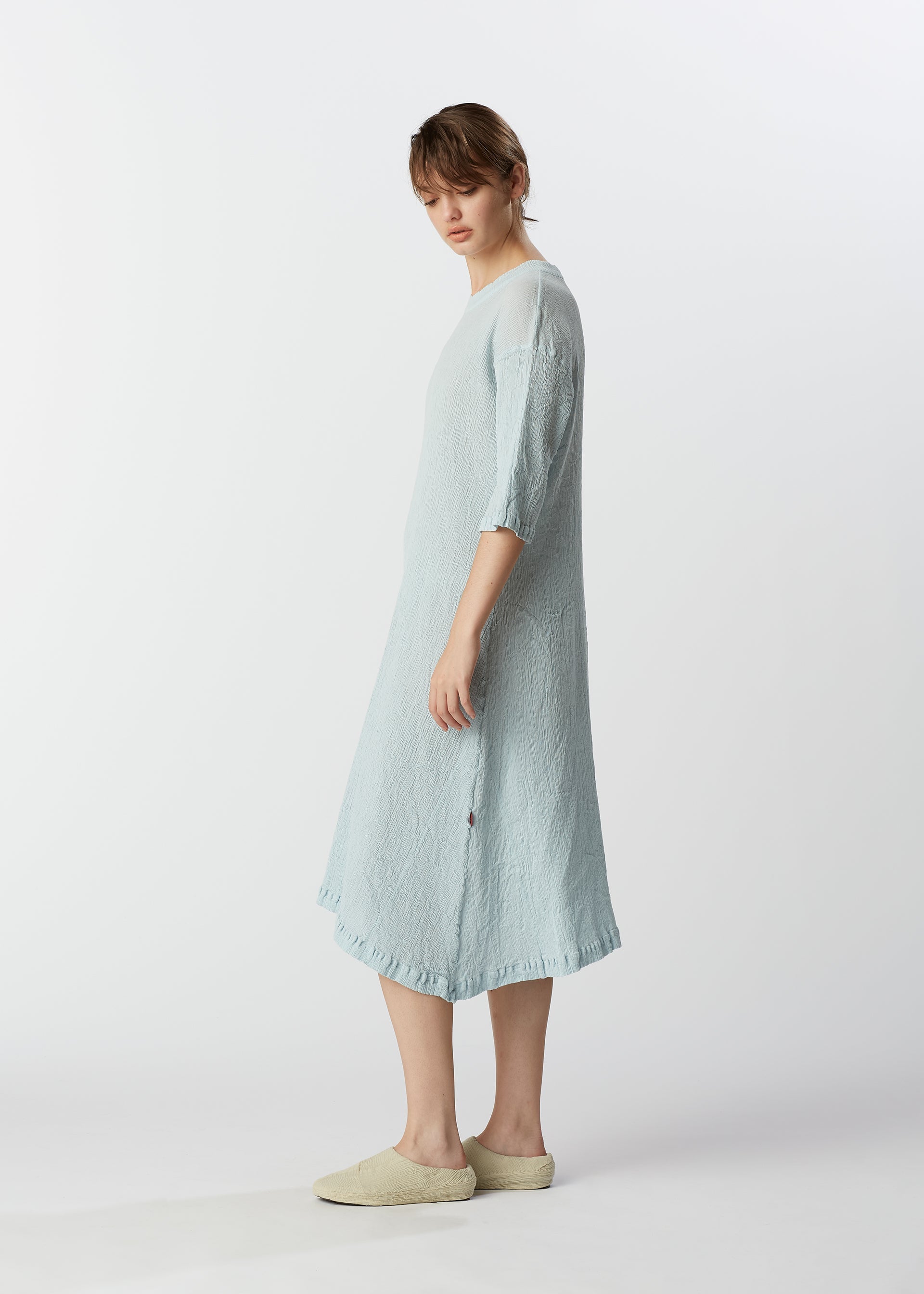 A model wears the HAAT KYO CHIJIMI MAY dress.