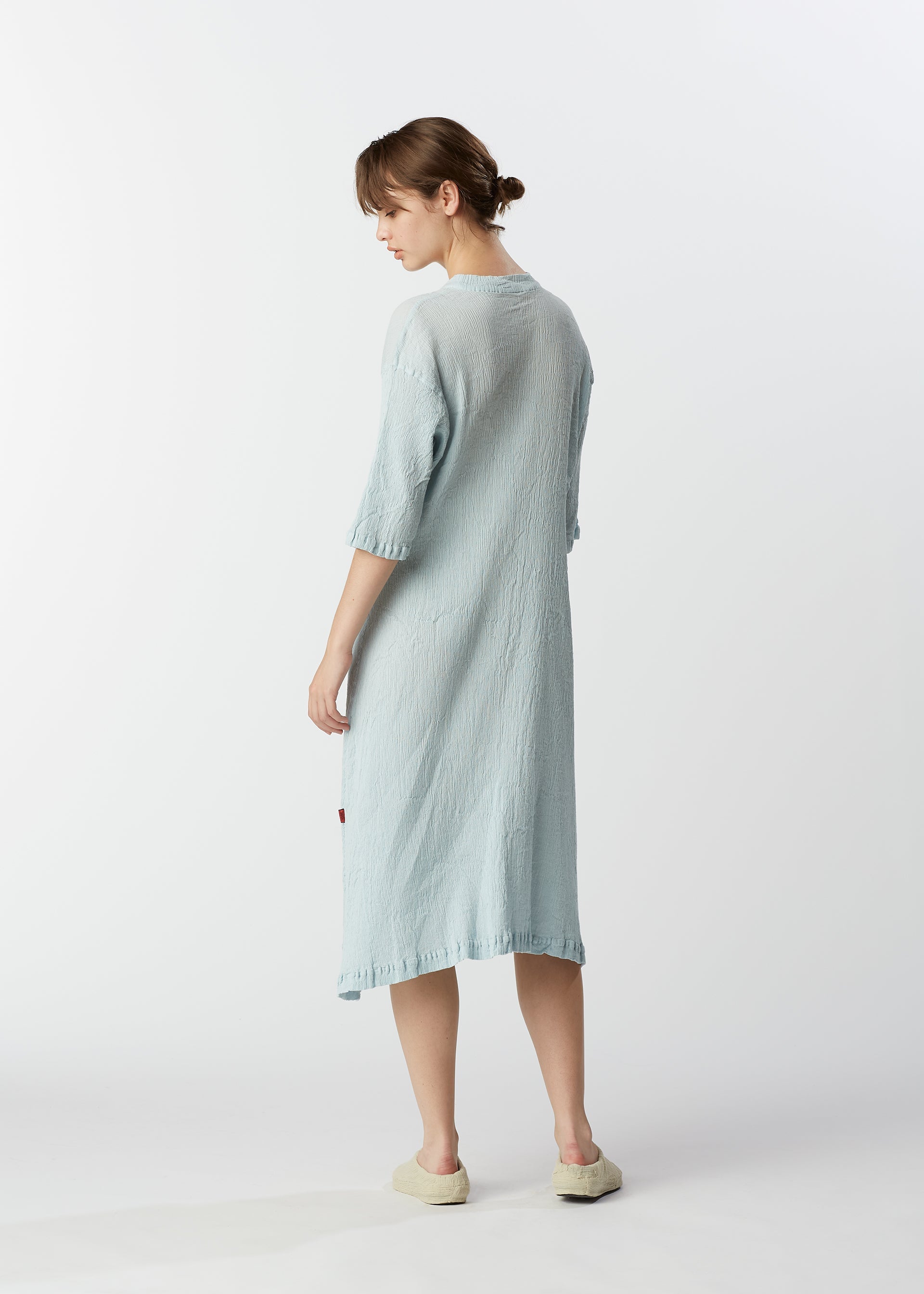 A model wears the HAAT KYO CHIJIMI MAY dress.