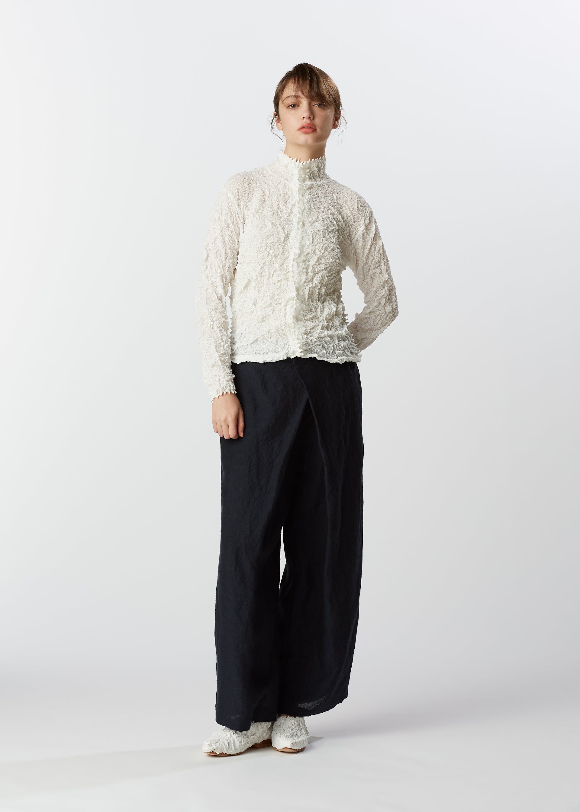 A model wears the HAAT KUMO SHIBORI SUCKER shirt.