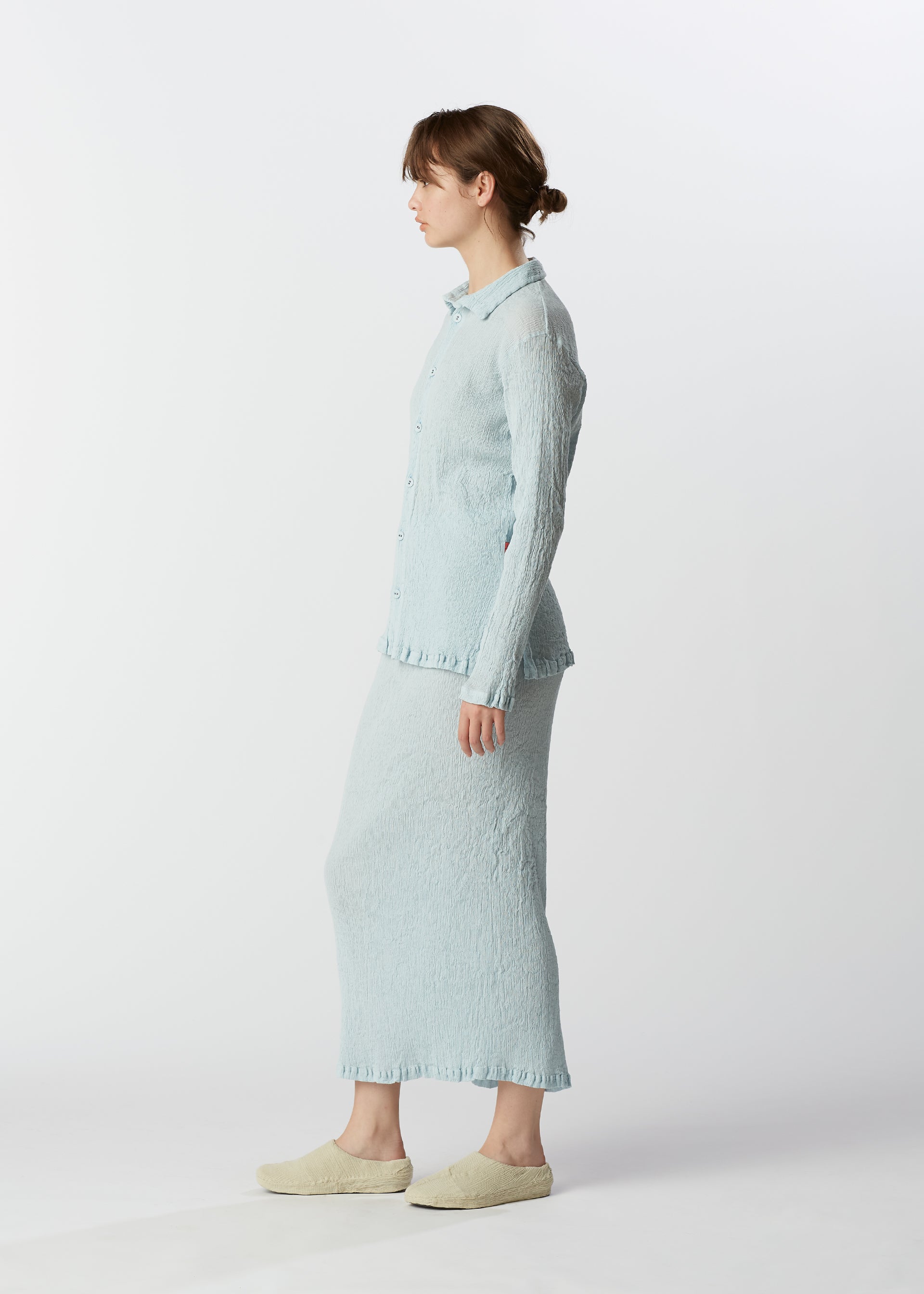 A model wears the HAAT KYO CHIJIMI MAY shirt.