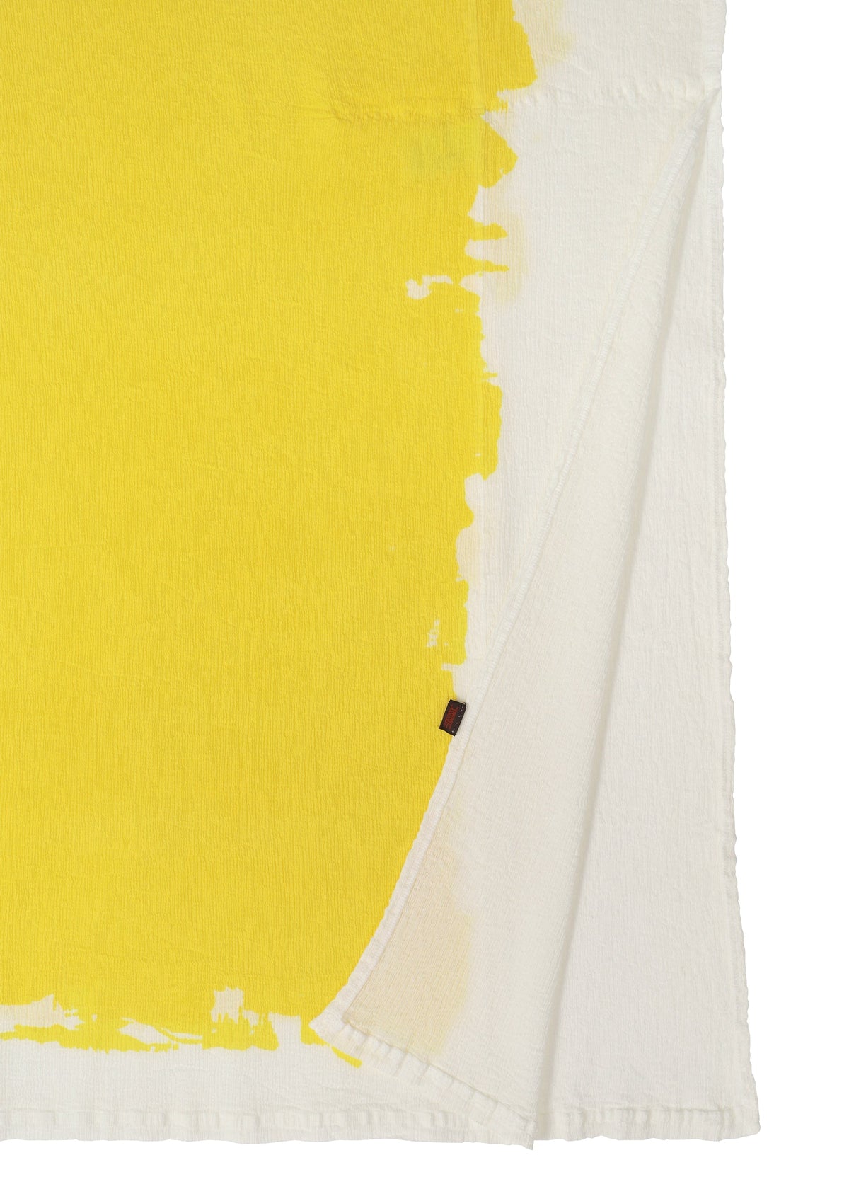A detail shot of the HAAT KYO CHIJIMI OVER PRINT cardigan.