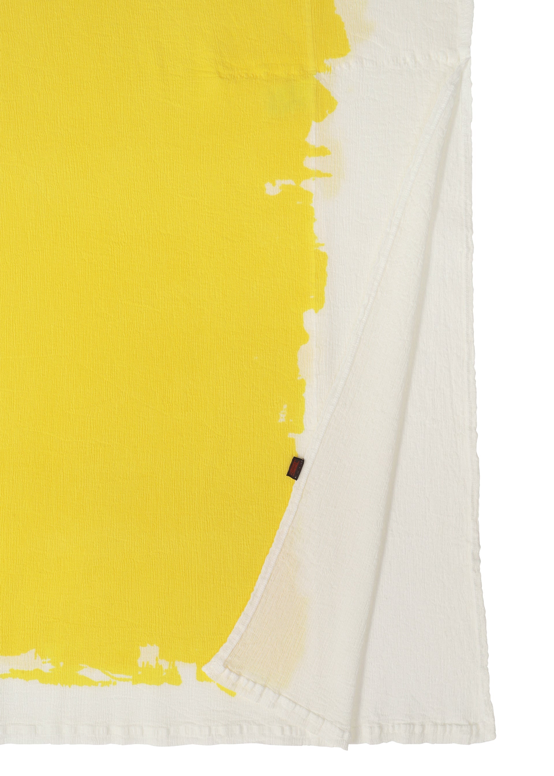 A detail shot of the HAAT KYO CHIJIMI OVER PRINT cardigan.