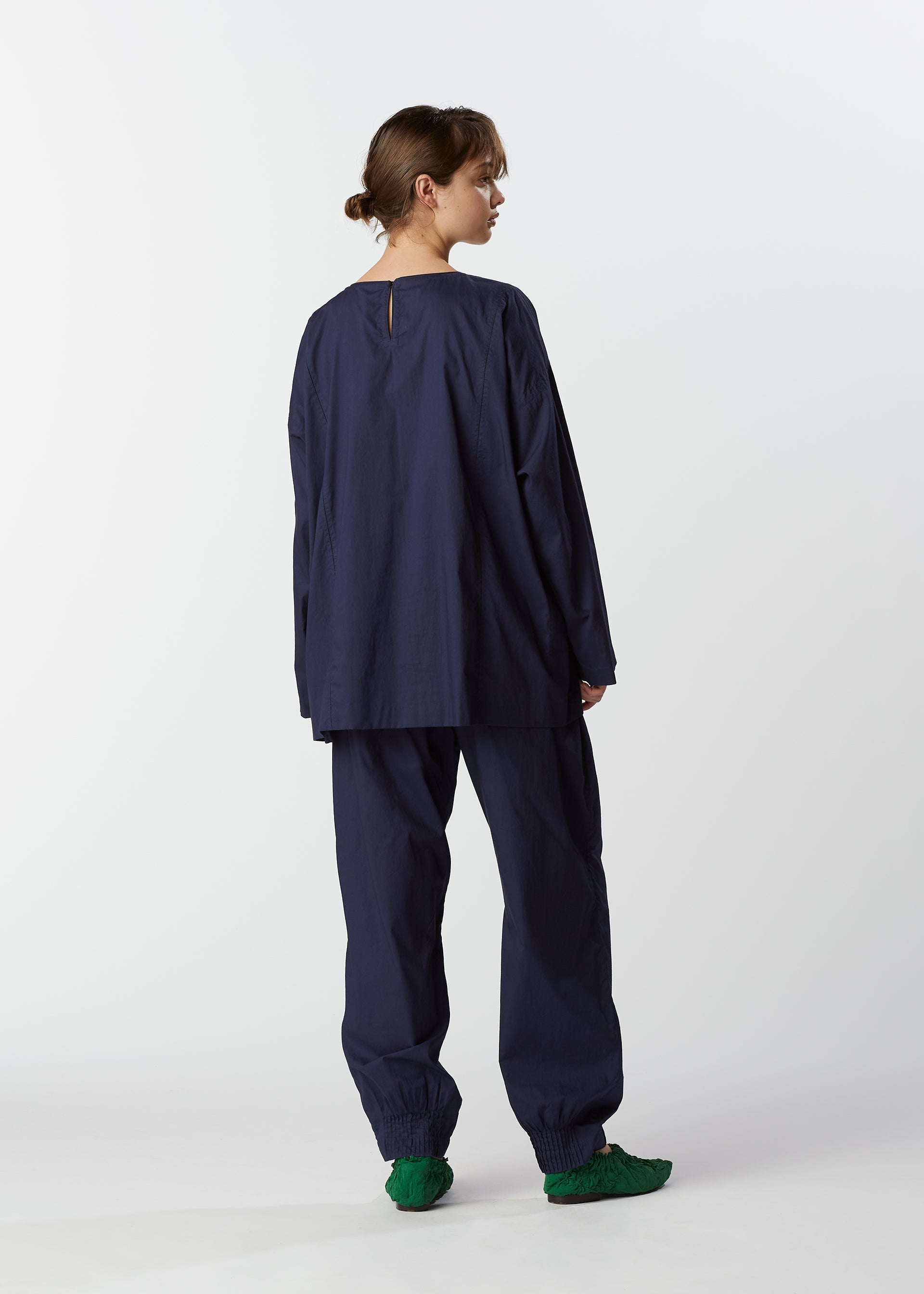 A model wears the HAAT BABY JALI shirt.