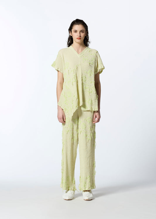 A model wears the HAAT KYO CHIJIMI CUT LOOP trousers.