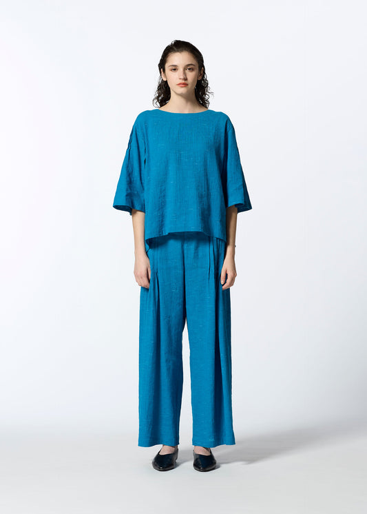 A model wears the HAAT PINTUCKING shirt.