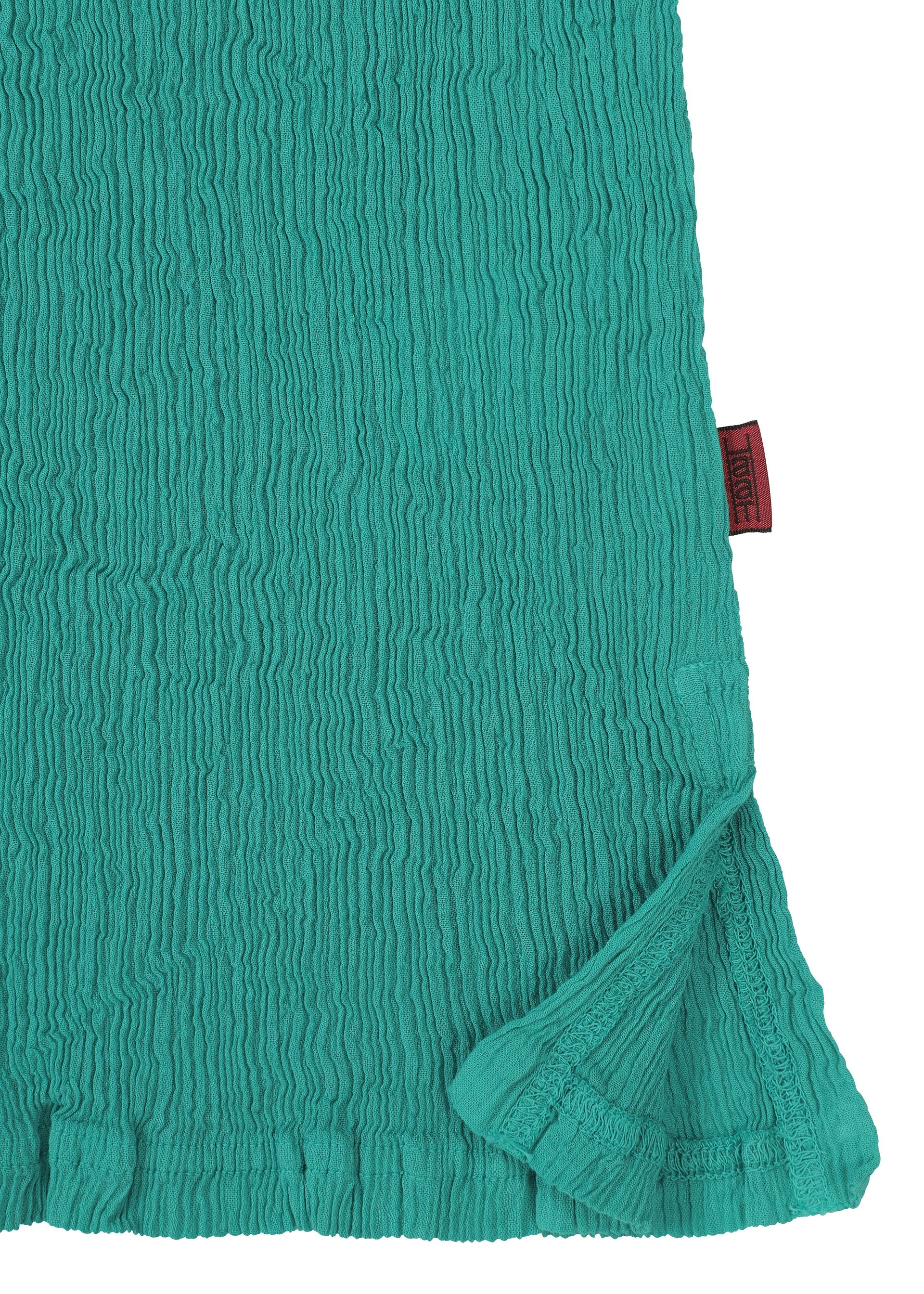 A detail shot of the HAAT KYO CHIJIMI AUGUST shirt.
