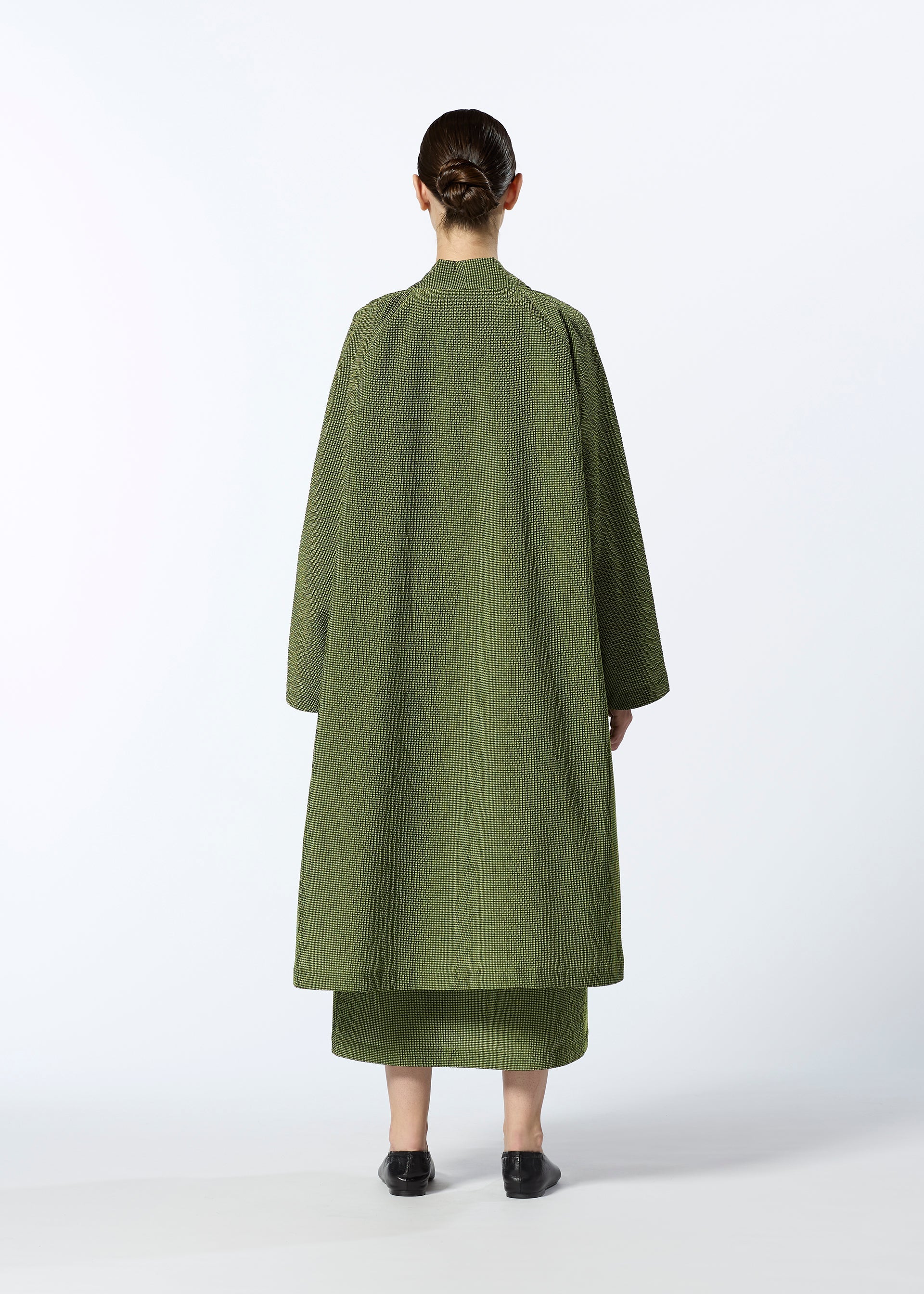 A model wears the HAAT LIGHT WEIGHT cardigan.