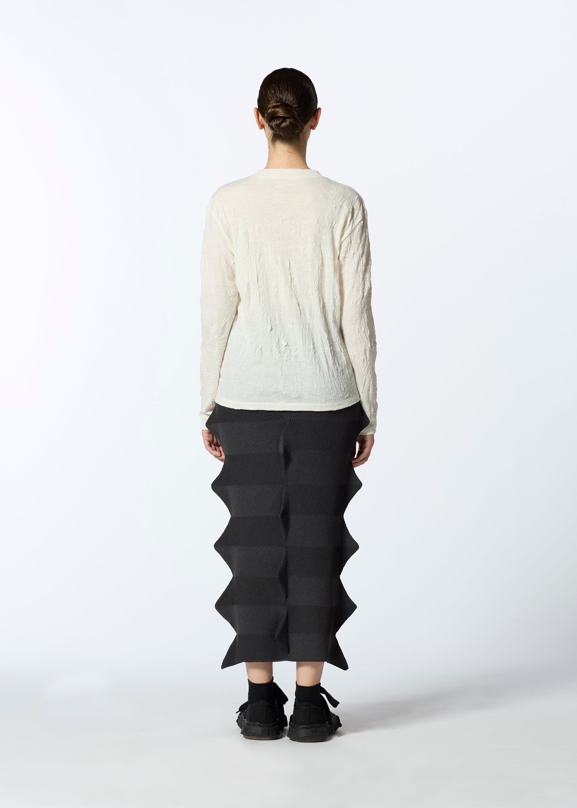 A model wears the HAAT 2001 FROM skirt.