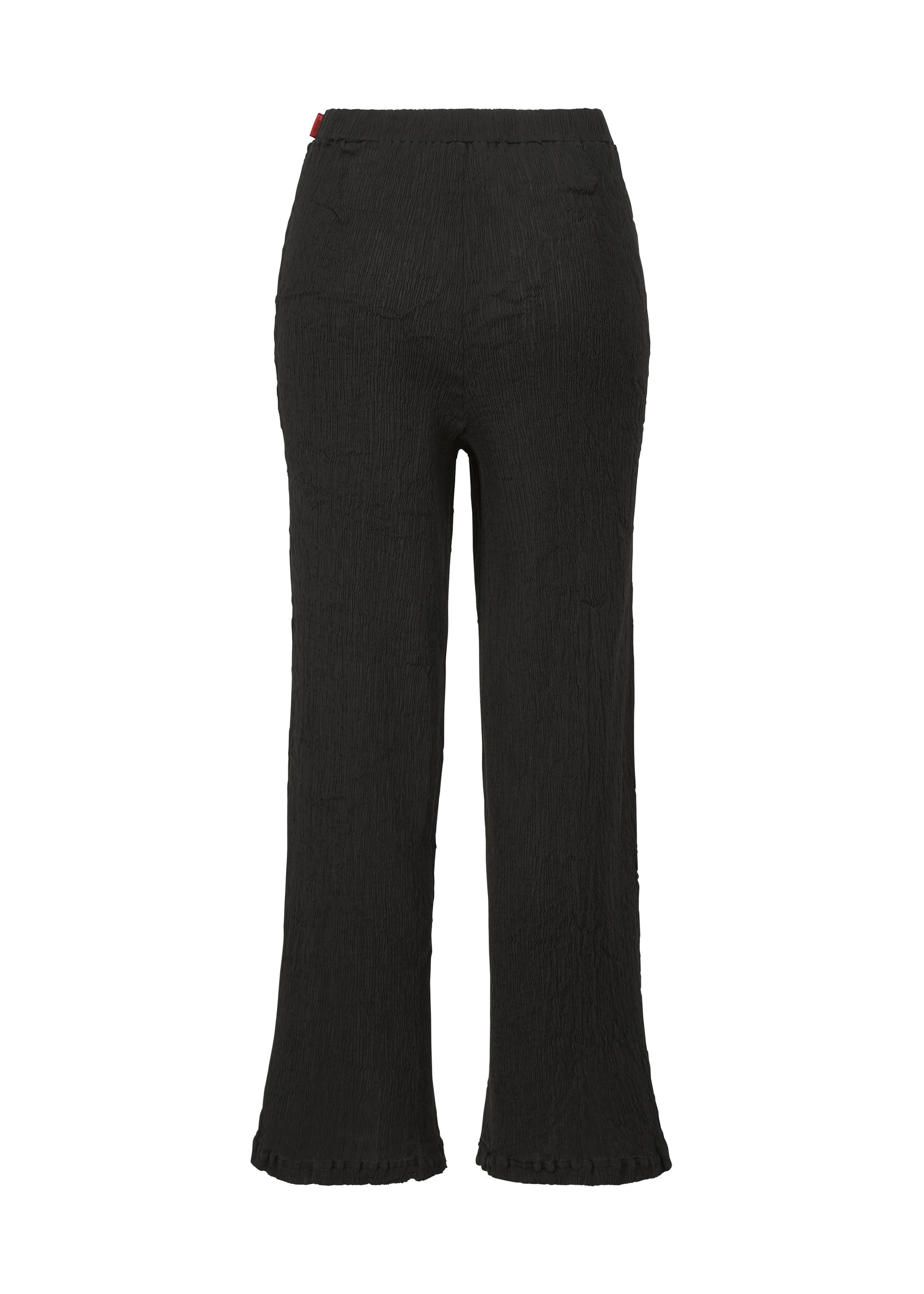 A detail shot of the HAAT KYO CHIJIMI BASIC trousers