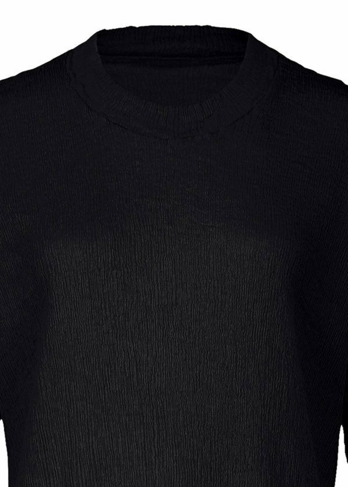 A detail shot of the HAAT KYO CHIJIMI BASIC dress