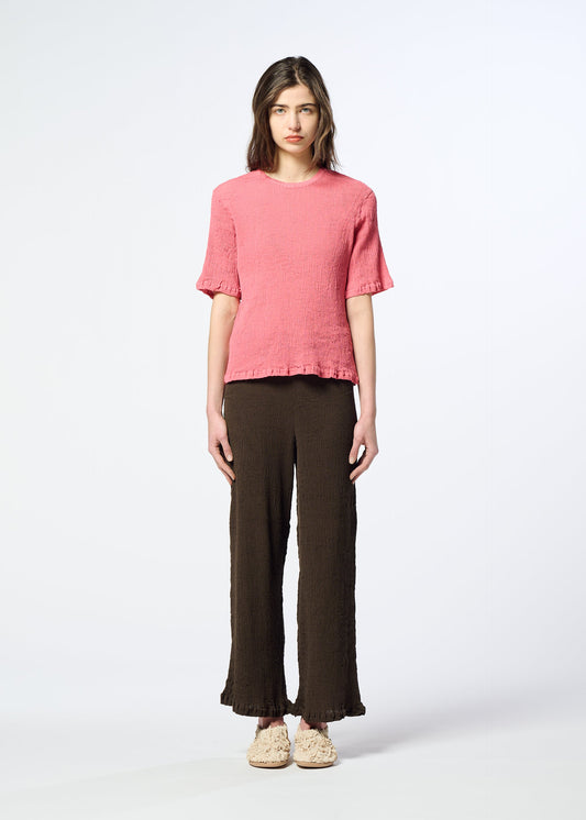 A model wears the HaaT KYO CHIJIMI AUGUST kyo-chijimi-august-top-coral.