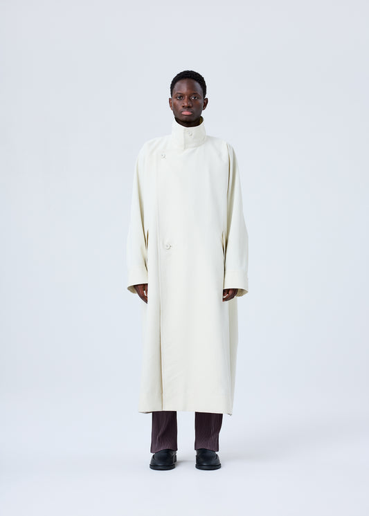 A model wears the HOMME PLISSÉ ISSEY MIYAKE RB_DRAWING COAT coat