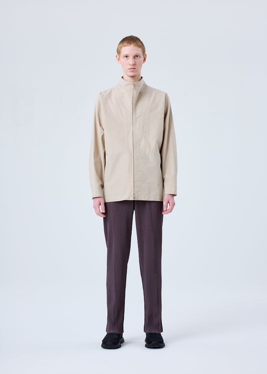 A model wears the HOMME PLISSÉ ISSEY MIYAKE PLEATS BOTTOMS 1 trousers