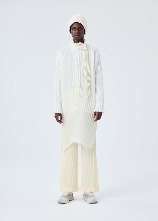 A model wears the HOMME PLISSÉ ISSEY MIYAKE BEANIE SCARF hat.