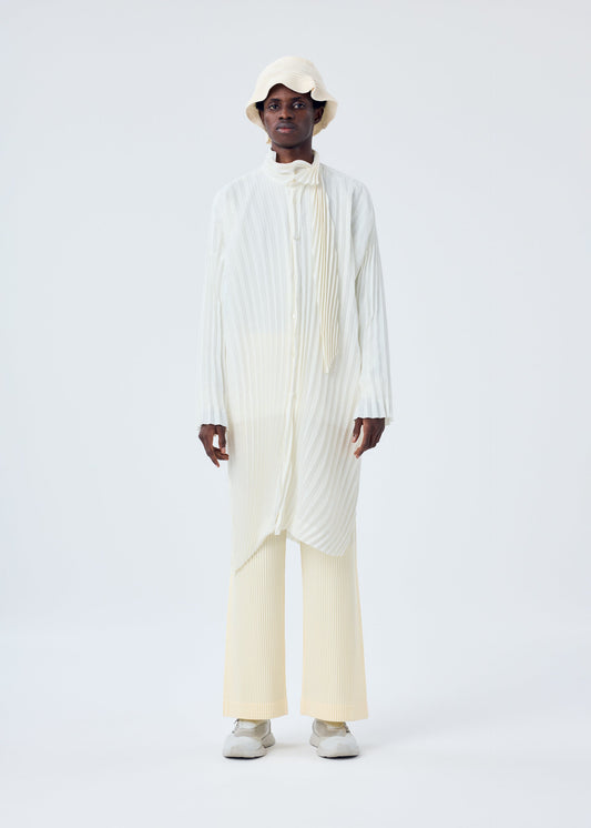 A model wears the HOMME PLISSÉ ISSEY MIYAKE BEANIE SCARF hat.