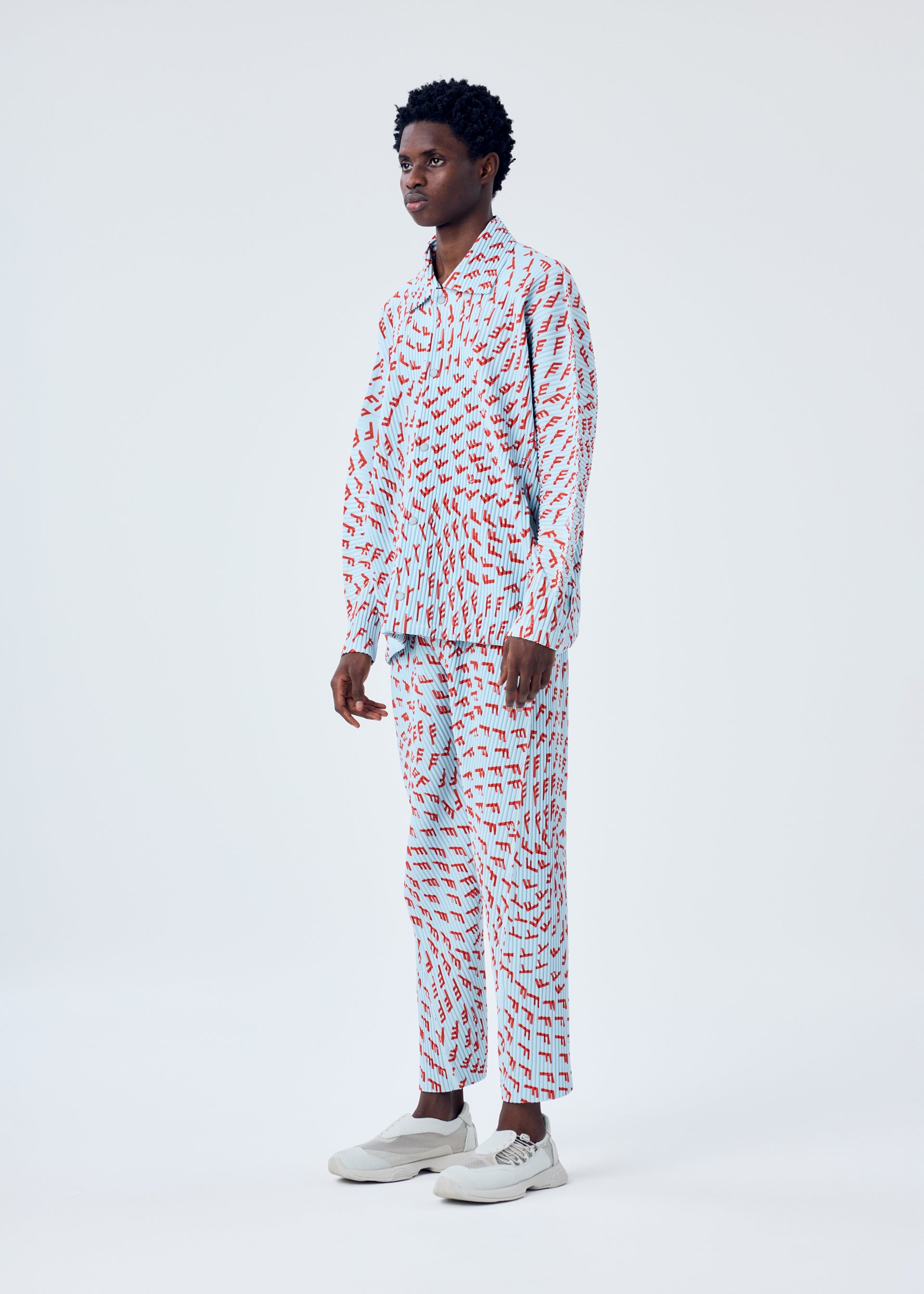 A model wears the HOMME PLISSÉ ISSEY MIYAKE WIND SPEED jacket.