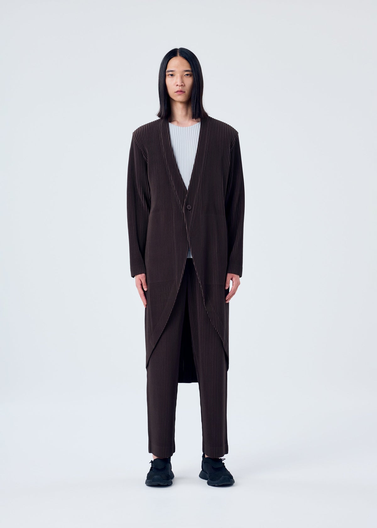 A model wears the HOMME PLISSÉ ISSEY MIYAKE TAILORED PLEATS 2 jacket.