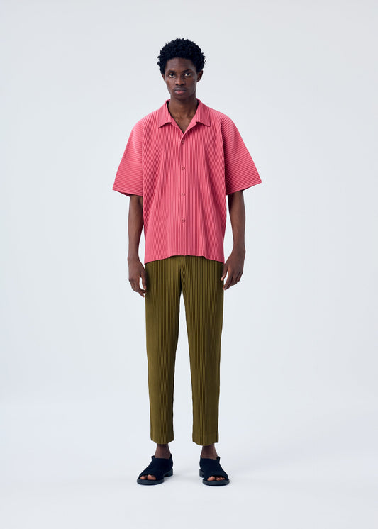 A model wears the HOMME PLISSÉ ISSEY MIYAKE MC APRIL shirt.
