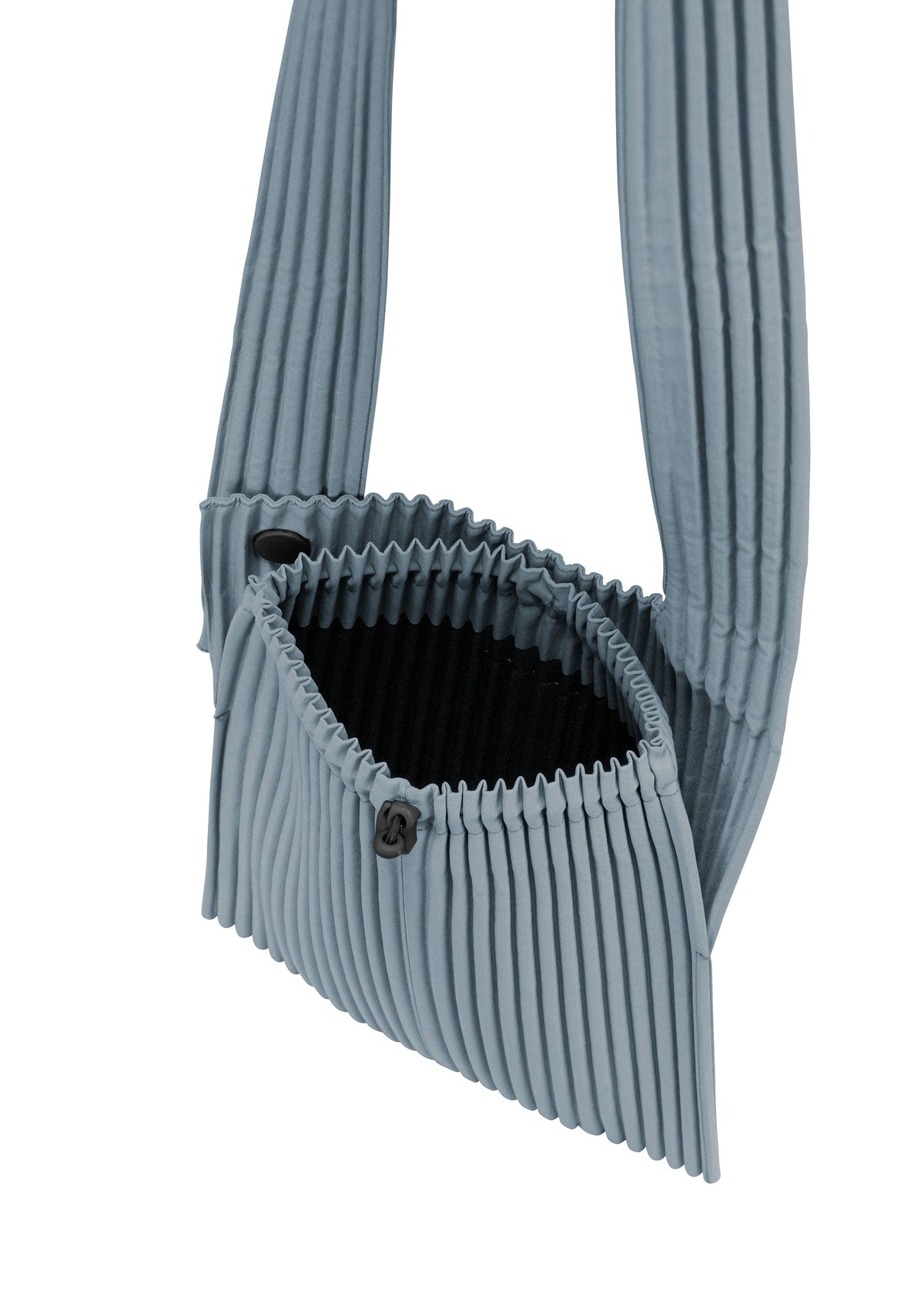 A detail shot of the HOMME PLISSÉ ISSEY MIYAKE POCKET bag.