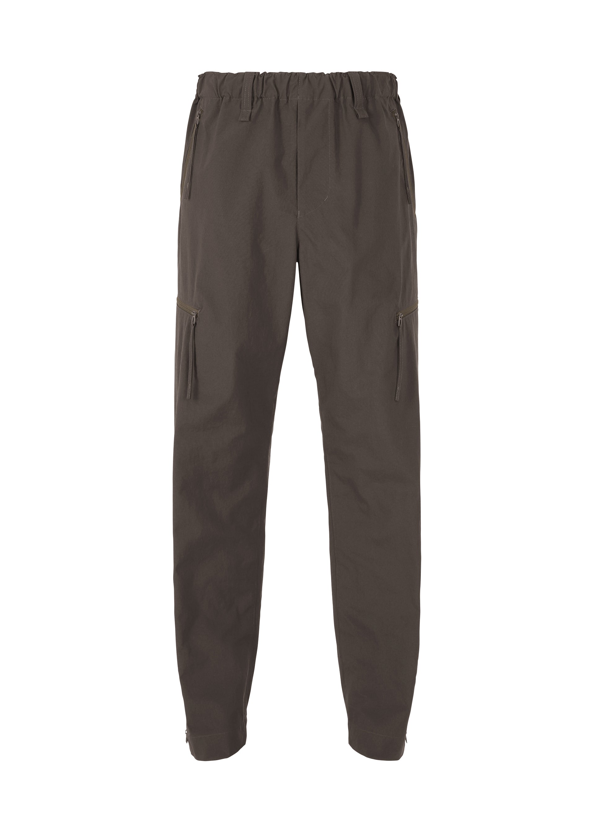 A product shot of the HOMME PLISSÉ ISSEY MIYAKE QUARRY PANTS trousers in dark brown (49).