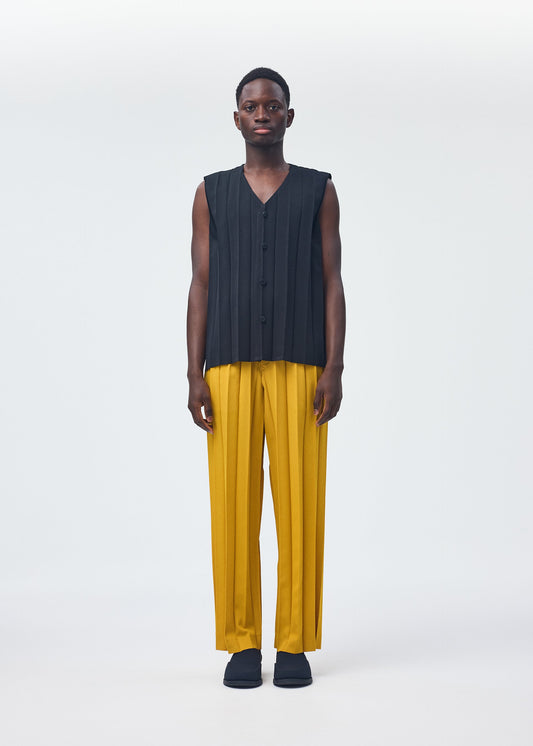 A model wears the HOMME PLISSÉ ISSEY MIYAKE EDGE ENSEMBLE trousers.