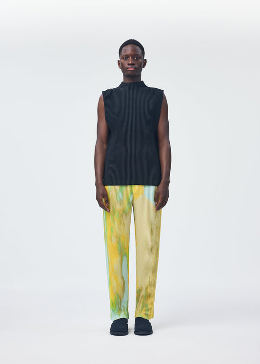 A model wears the HOMME PLISSÉ ISSEY MIYAKE AGATE trousers.