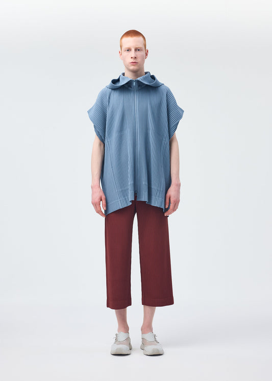 A model wears the HOMME PLISSÉ ISSEY MIYAKE MONTHLY COLORS AUGUST shirt.