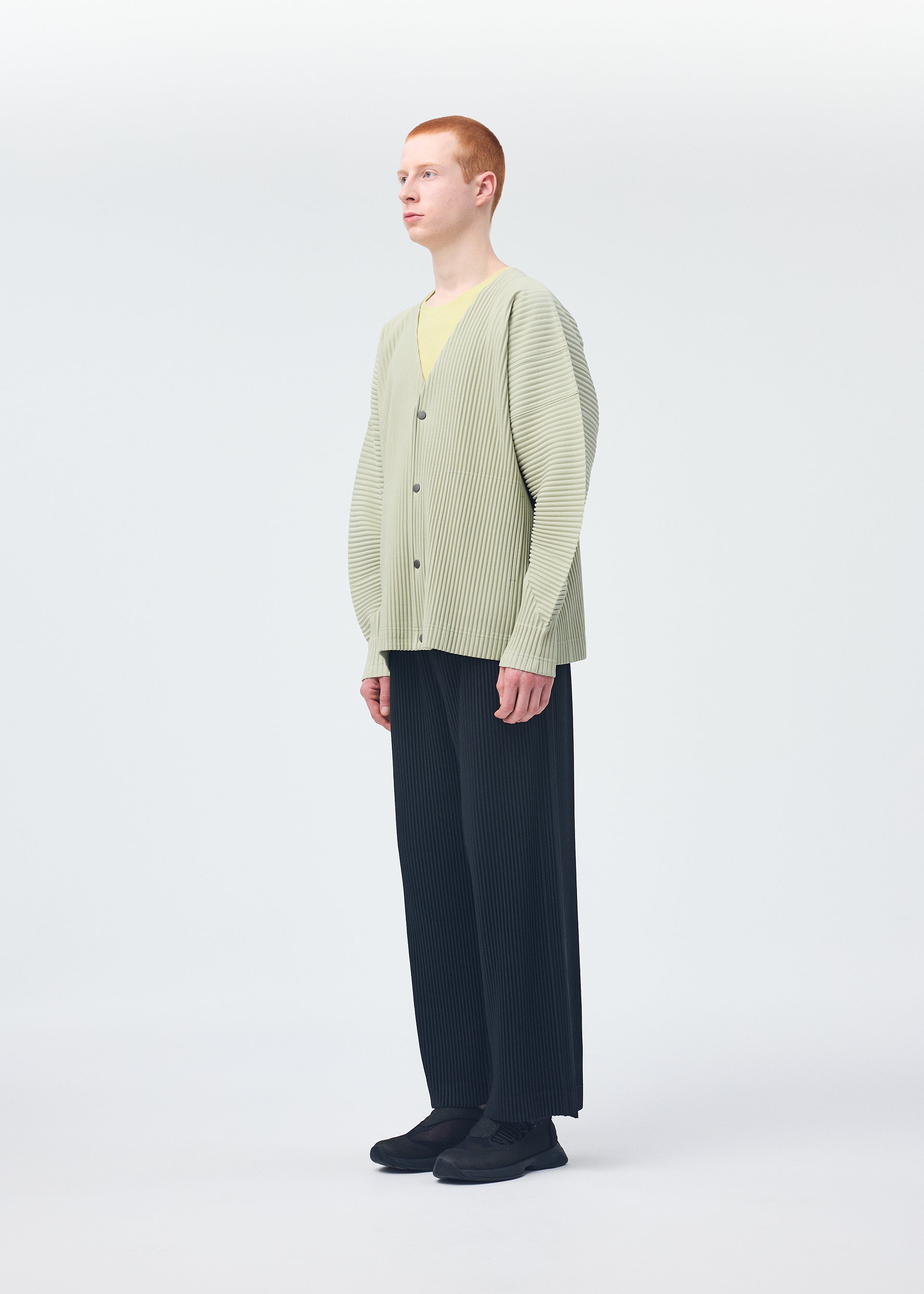 A model wears the HOMME PLISSÉ ISSEY MIYAKE MONTHLY COLORS OCTOBER shirt.