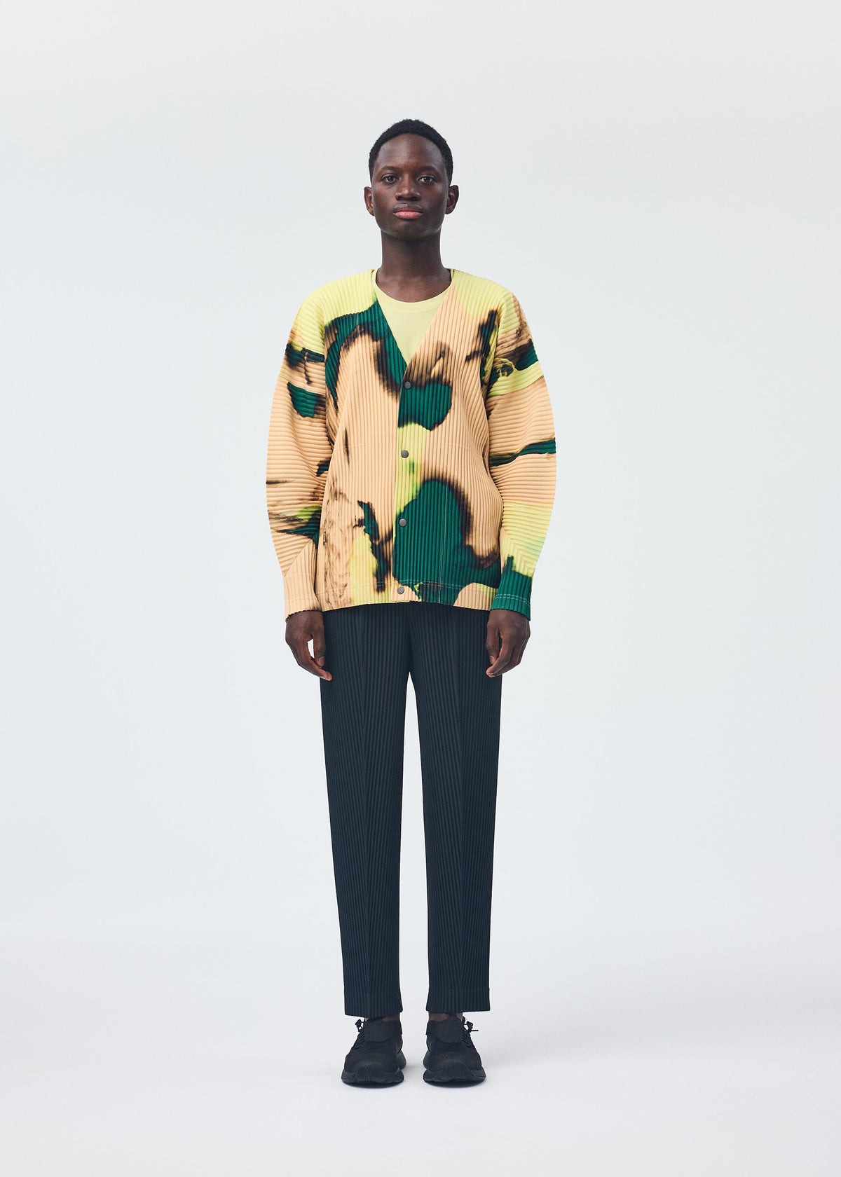 A model wears the HOMME PLISSÉ ISSEY MIYAKE AGATE shirt.