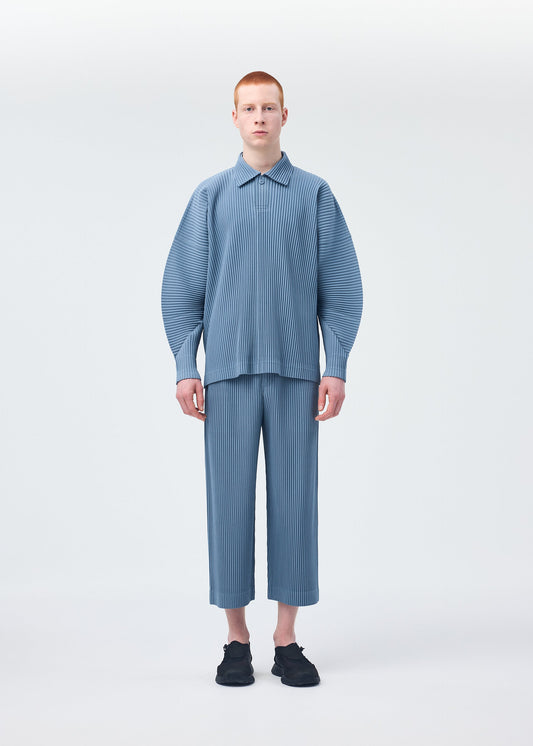 A model wears the HOMME PLISSÉ ISSEY MIYAKE MONTHLY COLORS AUGUST shirt.