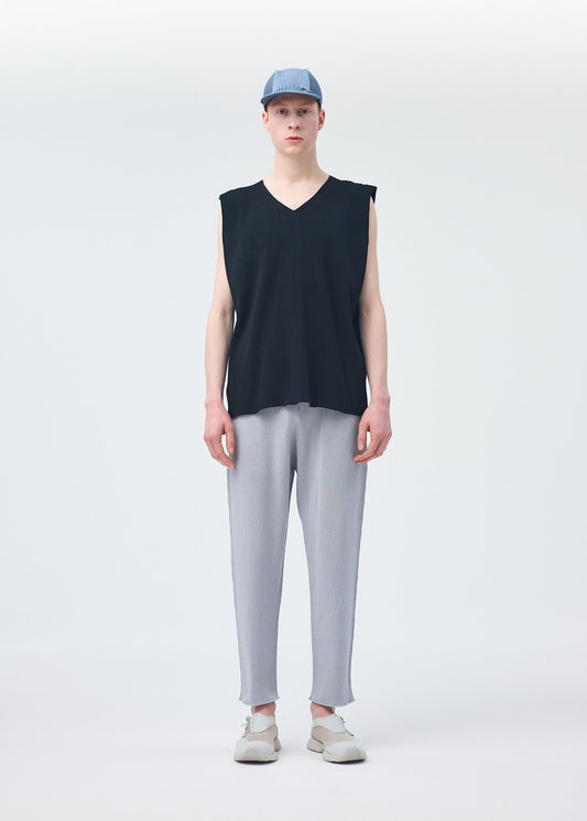 A model wears the HOMME PLISSÉ ISSEY MIYAKE BASIC KNIT vest.