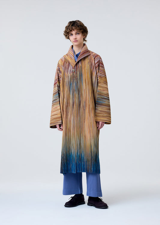 A model wears the HOMME PLISSÉ ISSEY MIYAKE PAINT BRUSH CLOSE UP coat.