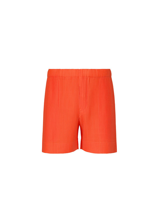 A product shot of the HOMME PLISSÉ ISSEY MIYAKE COLORFUL PLEATS BOTTOMS trousers in manarola boat orange.