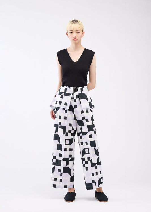 A model wears the 132 5. ISSEY MIYAKE BOX COMPOSITION trousers.