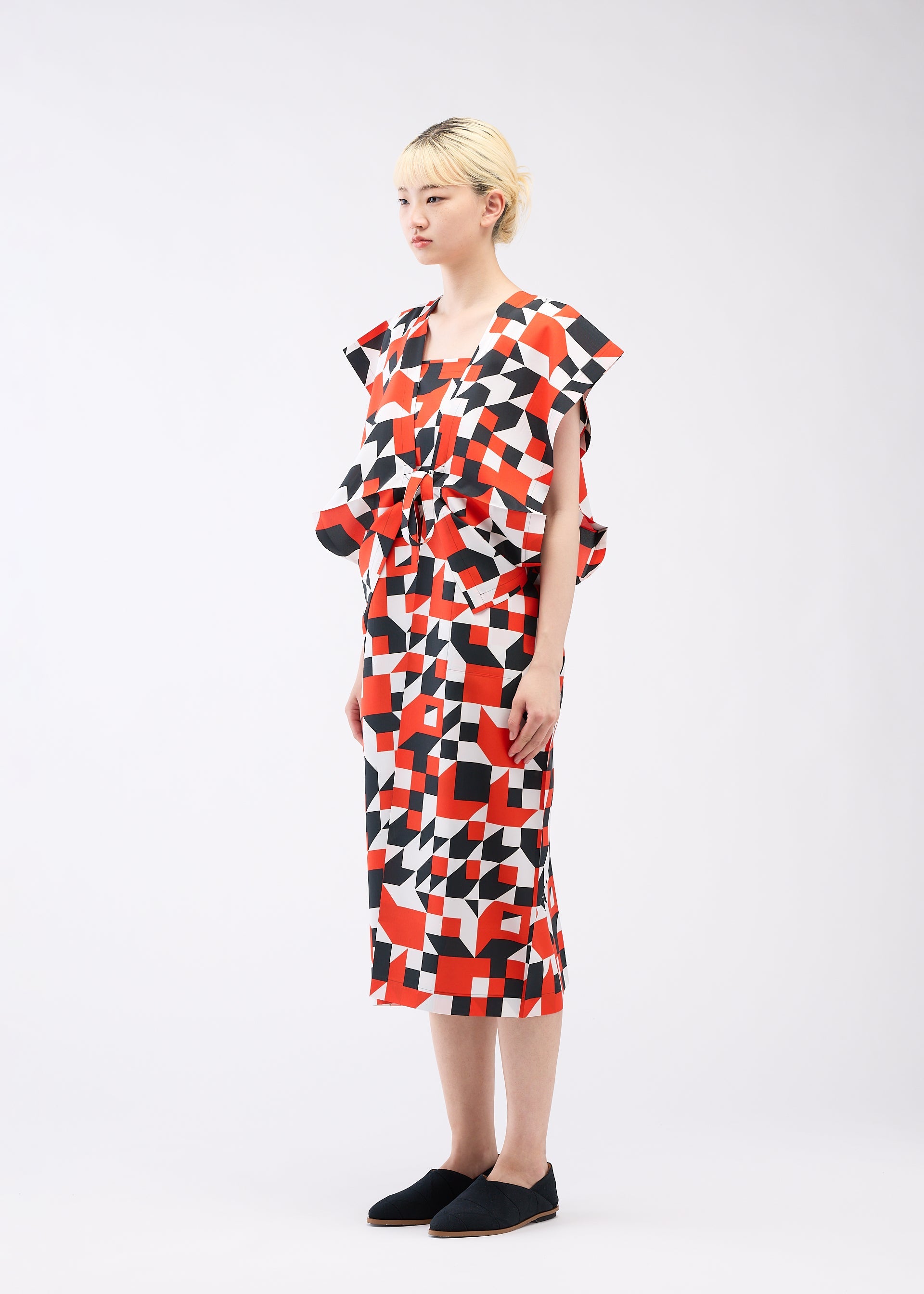 A model wears the 132 5. ISSEY MIYAKE BOX COMPOSITION dress.