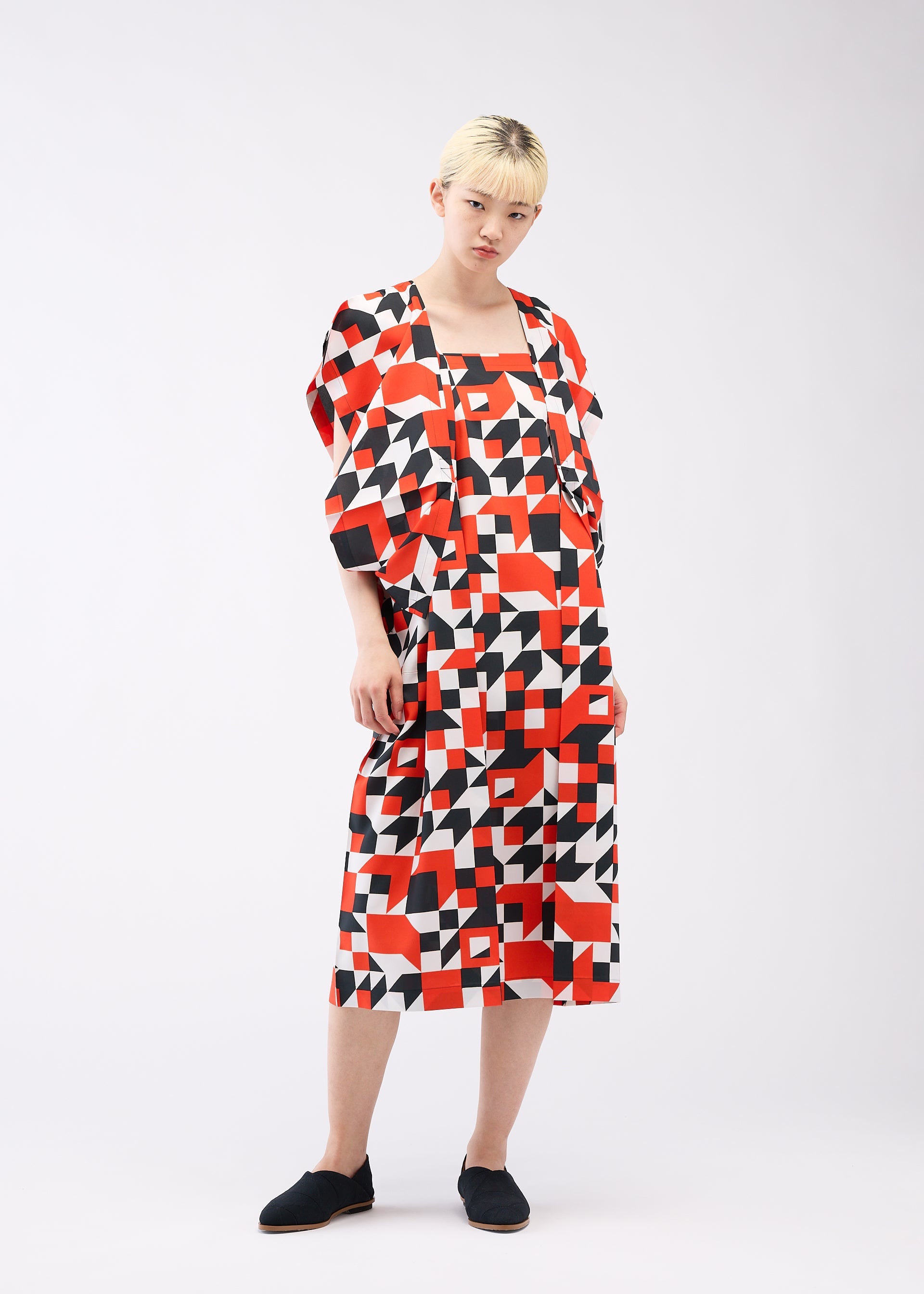 A model wears the 132 5. ISSEY MIYAKE BOX COMPOSITION dress.