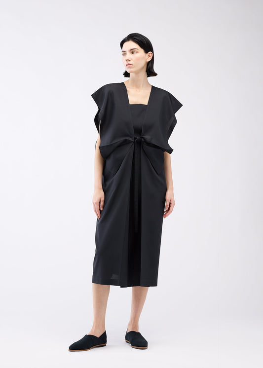 A model wears the 132 5. ISSEY MIYAKE BOX COMPOSITION SOLID dress.