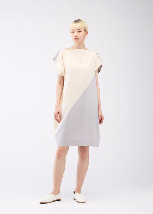 A model wears the 132 5. ISSEY MIYAKE FLAT T BI COLOR dress.