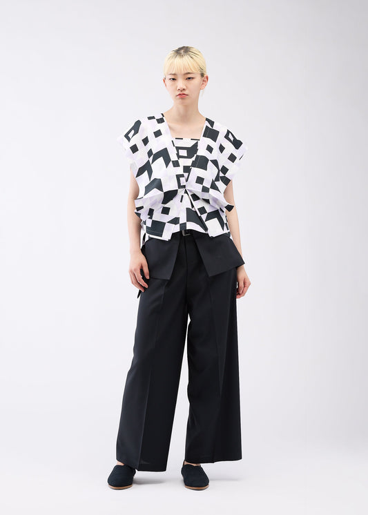 A model wears the 132 5. ISSEY MIYAKE BOX COMPOSITION shirt.