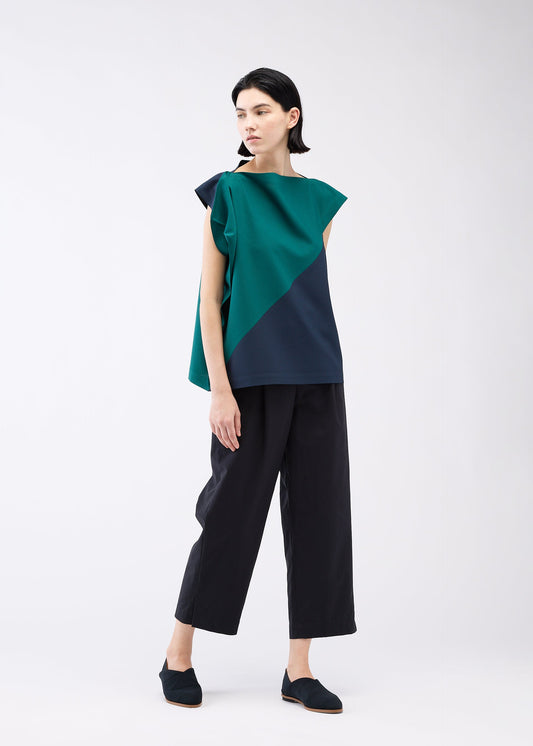 A model wears the 132 5. ISSEY MIYAKE FLAT T BI COLOR shirt.