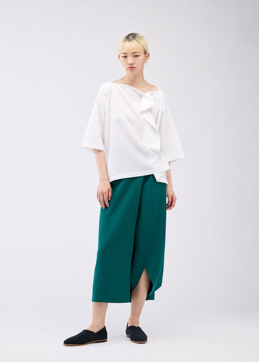 A model wears the 132 5. ISSEY MIYAKE FLAT ONE TUCK T shirt.