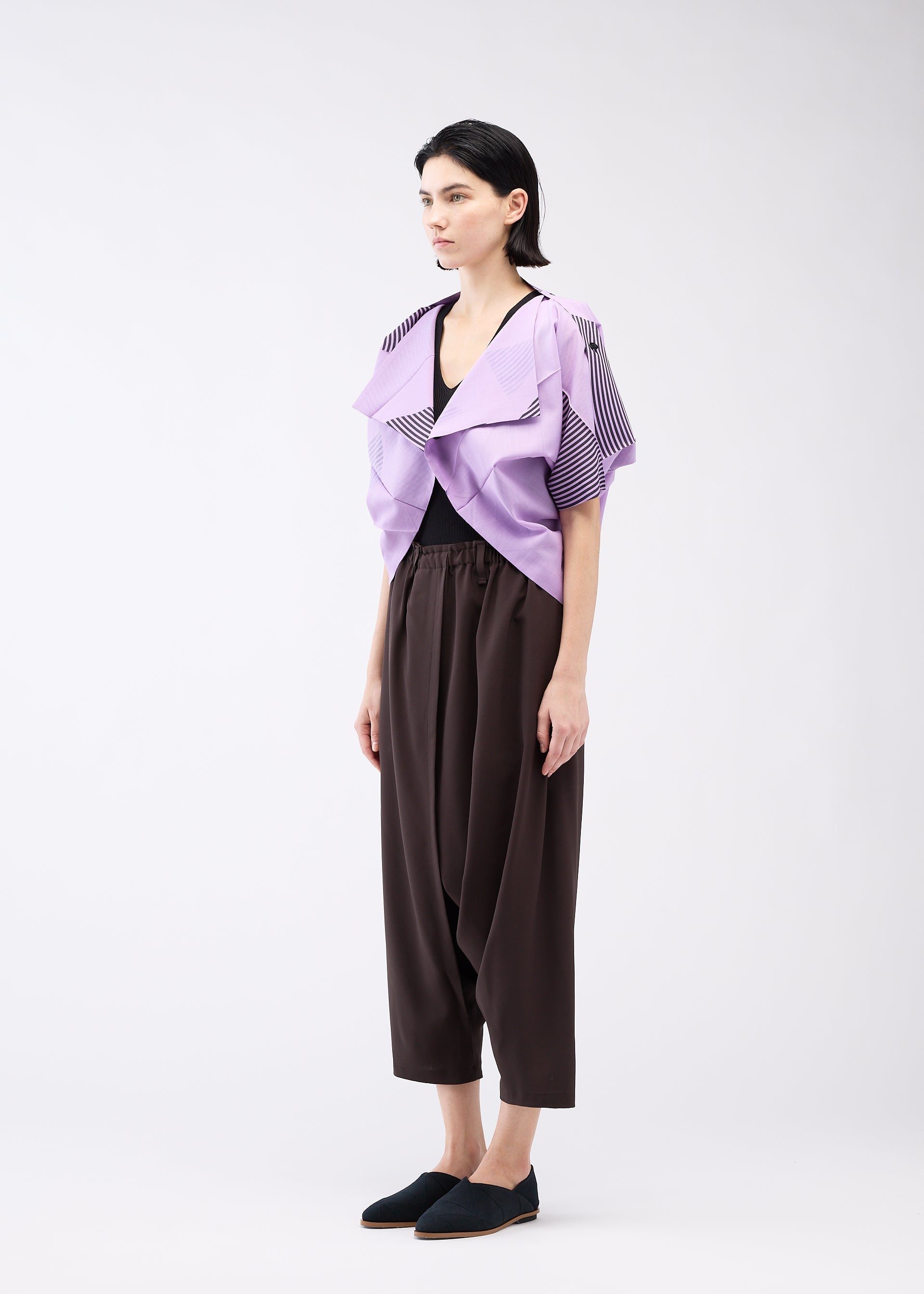 A model wears the 132 5. ISSEY MIYAKE FOLD RAMIE PRINT cardigan.